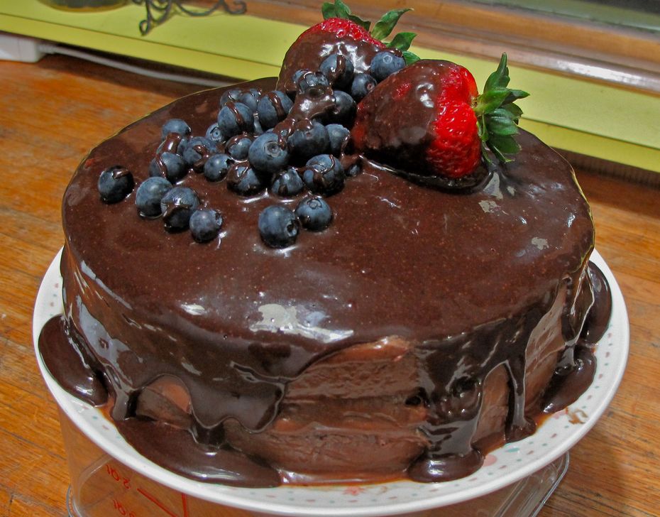 Double chocolate fudge cake with strawberries and blueberriers.JPG