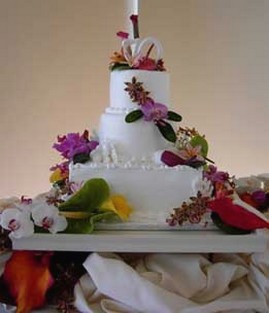 tropical wedding cake photos with colorful flowers