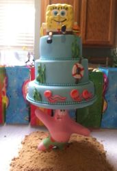 3 tier Spongebob Squarepants cake with Spongbob on top and Patrick on the bottom holding up cake.JPG
