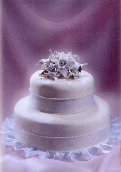 white two wedding cake with floral topper