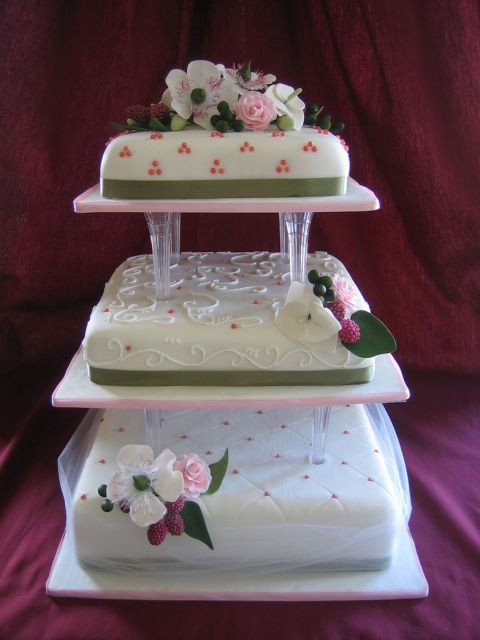 a 50th anniversary cake with fresh flowers.jpg