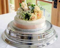 Single tier wedding cake with fresh flowers on top.JPG