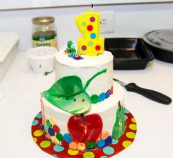 Birthday cake for 1 year old with worm and green leaf in 2 tiers.JPG