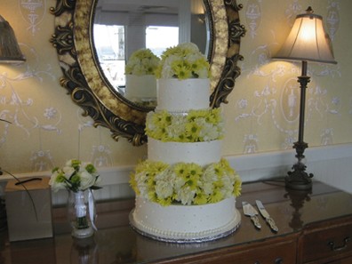 three tier Wedding cake with yellow flowers