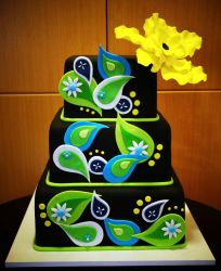 Unique 3 level black cake with green raindrops decor and large yellow flower on top.JPG