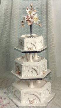 Wedding cake royal in three tier and has tall topper