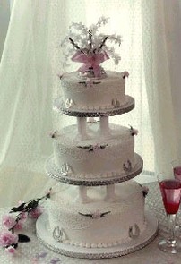 wedding cake royal iced with three tier and unique toper