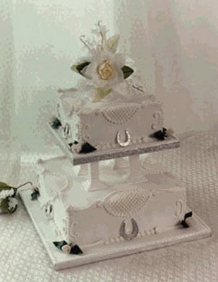 wedding cake royal iced in square shape with topper flower