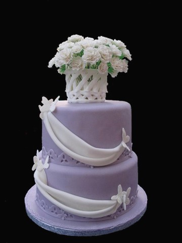 wedding purple cake with white cake decor and flowers pix