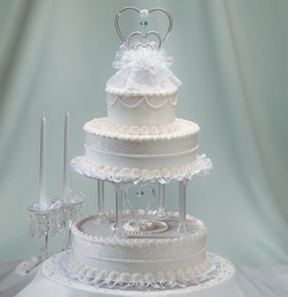 Whole whte wedding cake with three tier photos