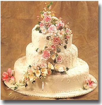 wedding cake with roses in pink and cream colors picture