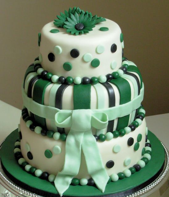 Tri level wedding cake with green flowers and pokadots.JPG