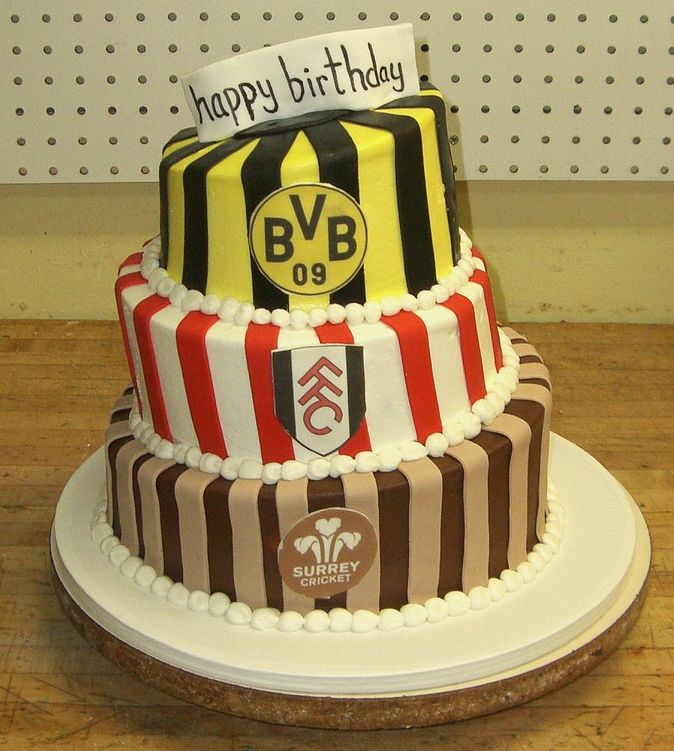 Three tier British sports birthday cake.JPG