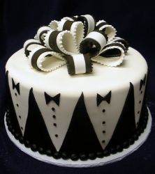 Grooms cake with tuxedo patterns and black and white bowtie.JPG