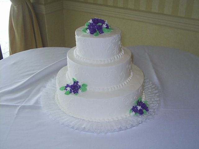 Image of white Wedding Cakes with dark purple flowers