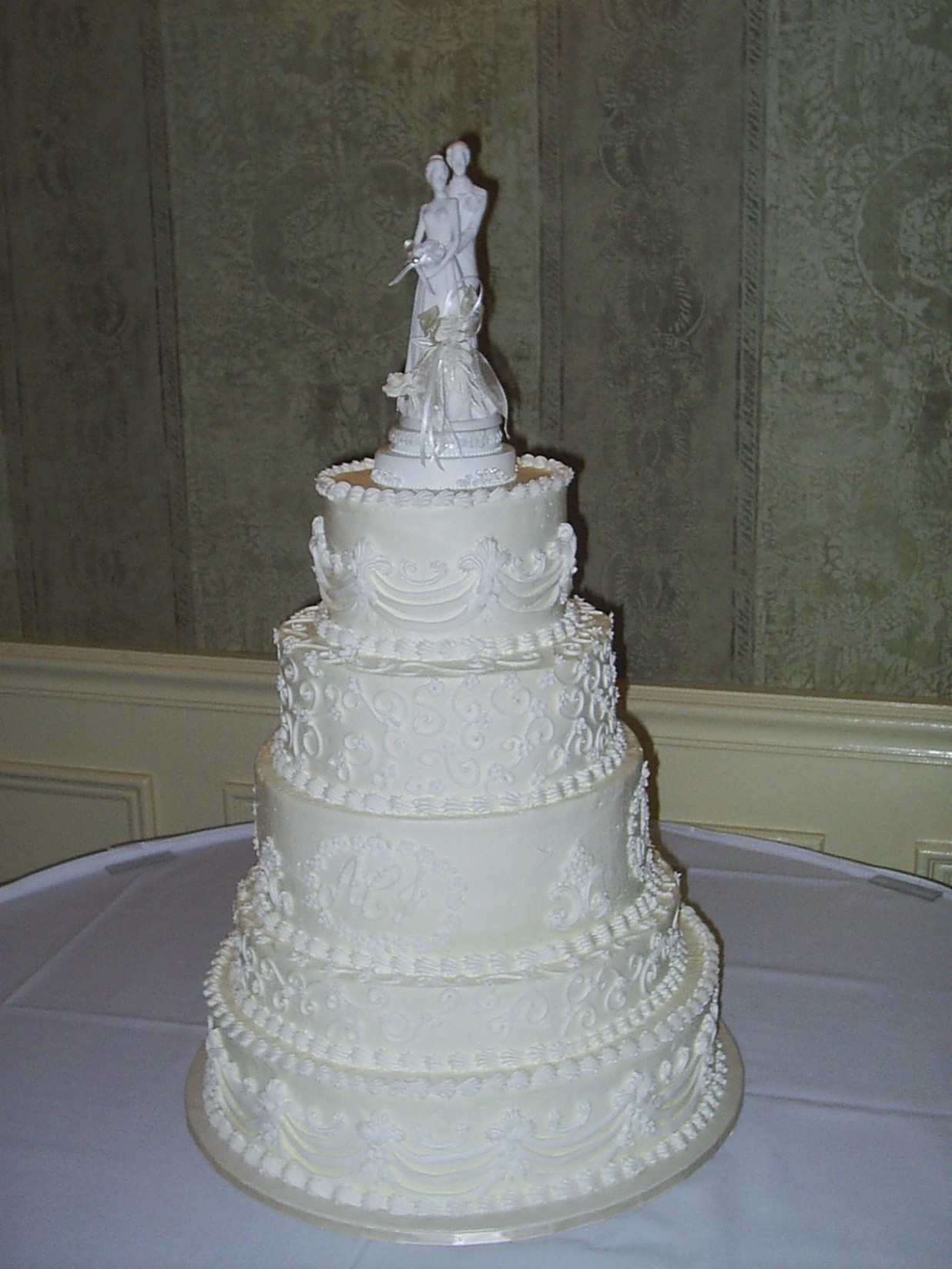White Wedding Cakes with toper and pretty patterns