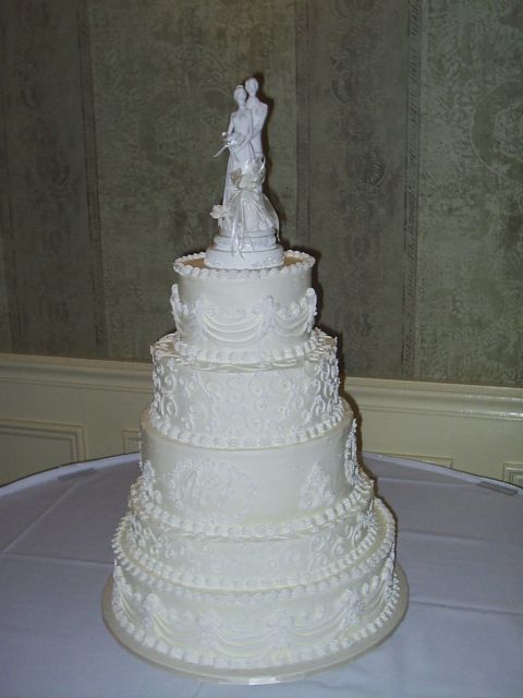 White Wedding Cakes with toper and pretty patterns