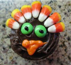 Cute Thanksgiving cake looking at the camare.JPG