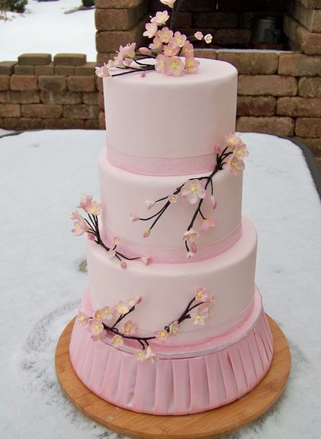 3 level round pink cake with cherry blossoms and branches.JPG