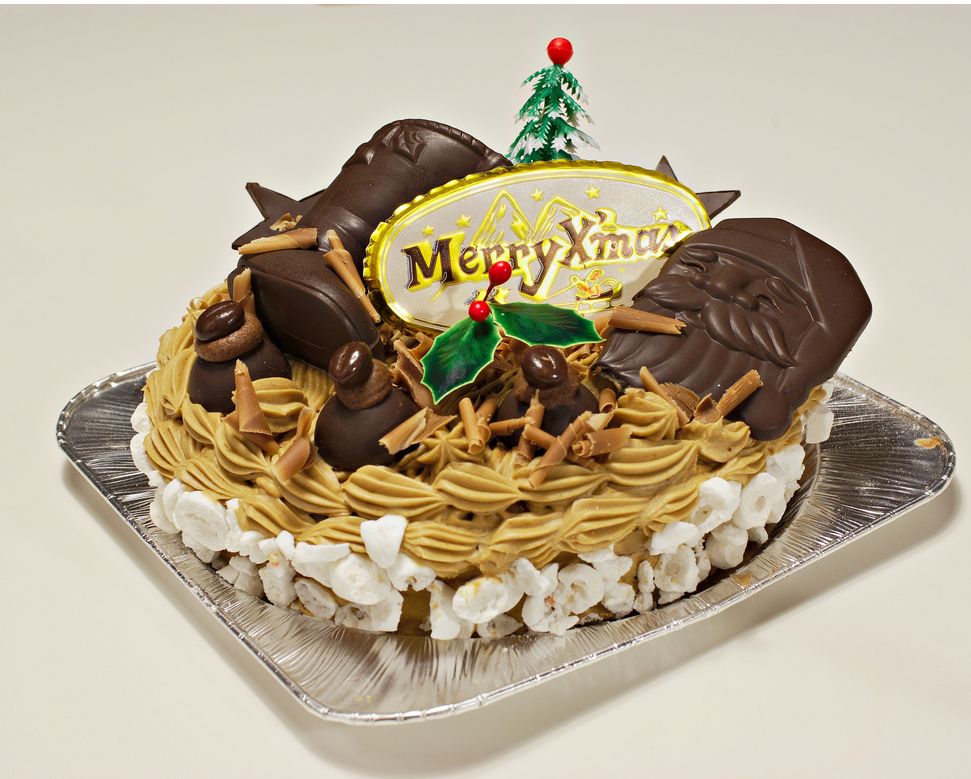 Christmas holiday cake with chocolate santa face and boots.JPG
