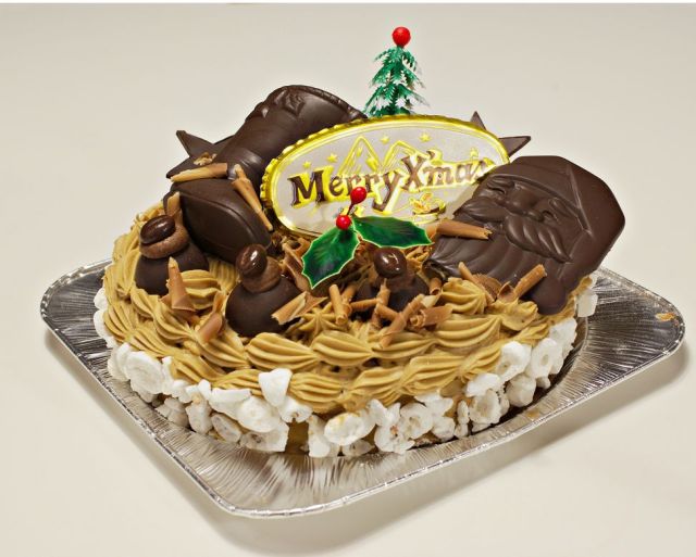 Christmas holiday cake with chocolate santa face and boots.JPG