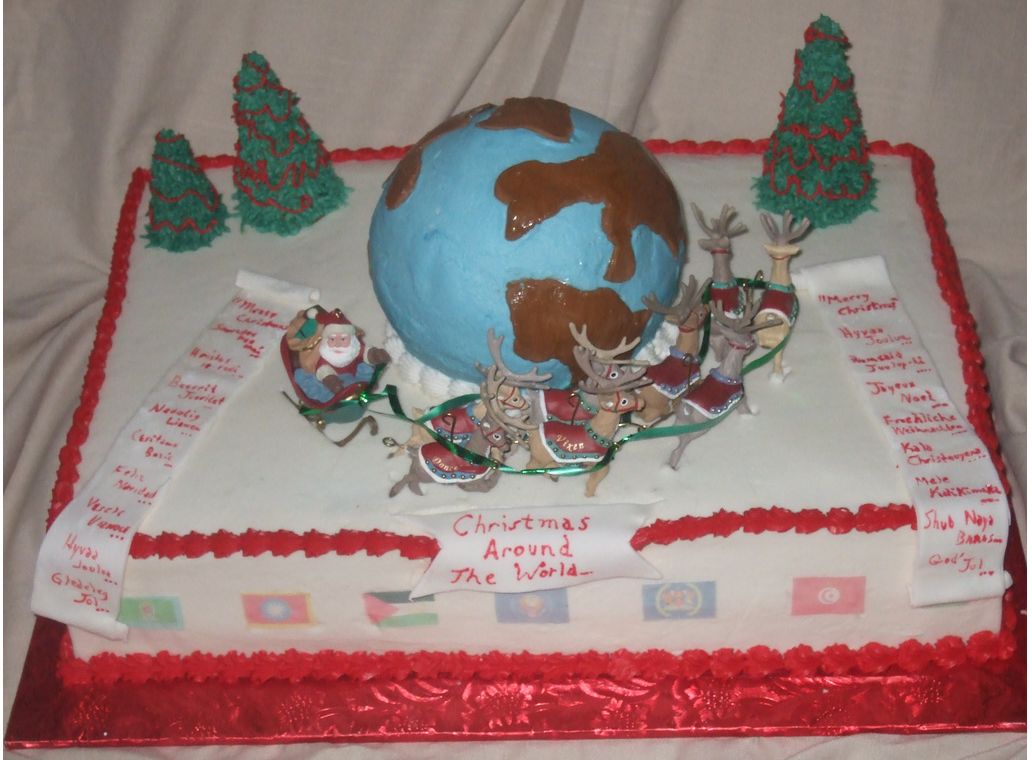 Santa goes around the global Christmas Cake.JPG