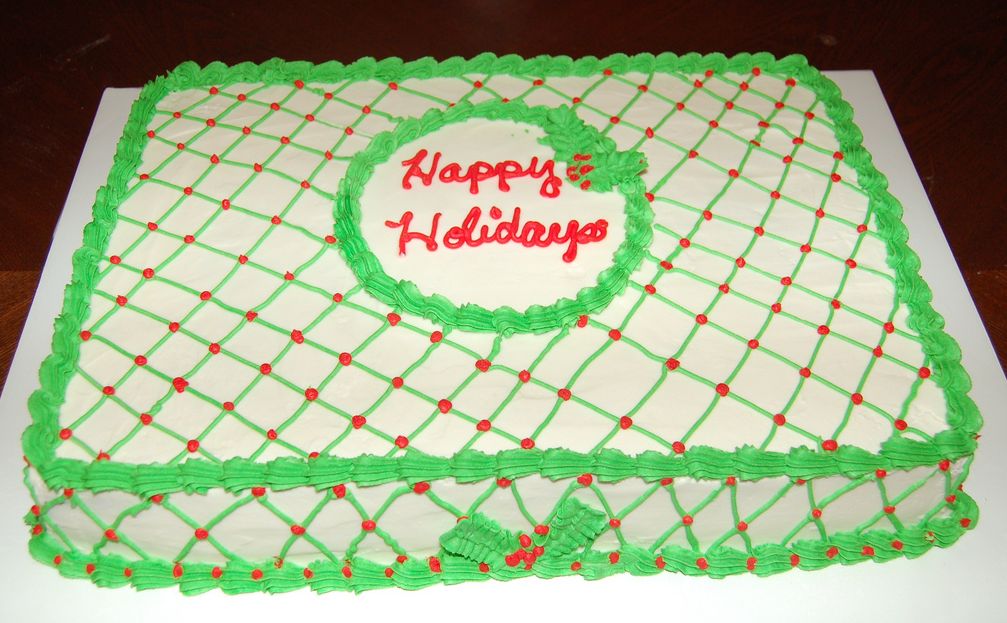 Square Christmas cake with green patterns and red dot.JPG