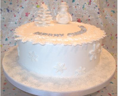 White Christmas cake with snowman figure.JPG