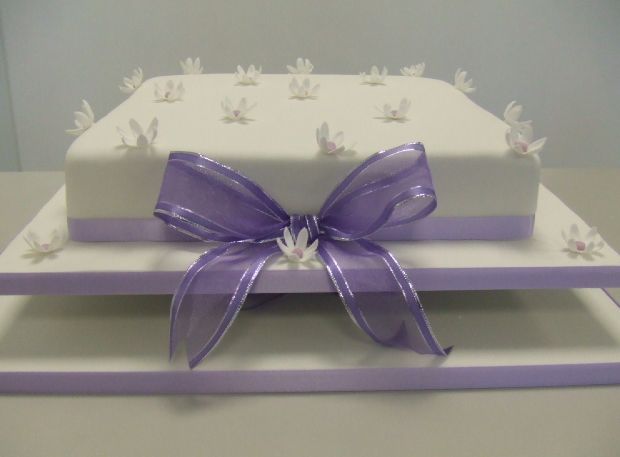 One tier 12 inch white wedding cake with lavender ribbon.JPG