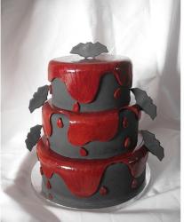 Three tier halloween cake with bats and blood.JPG