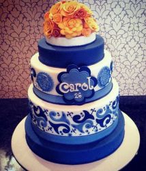 4 Tier White and Blue Patterned Birthday Cake for Woman with Orange Flowers Topper.JPG