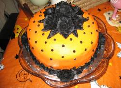 Beautiful orange halloween cake with black roses top.JPG