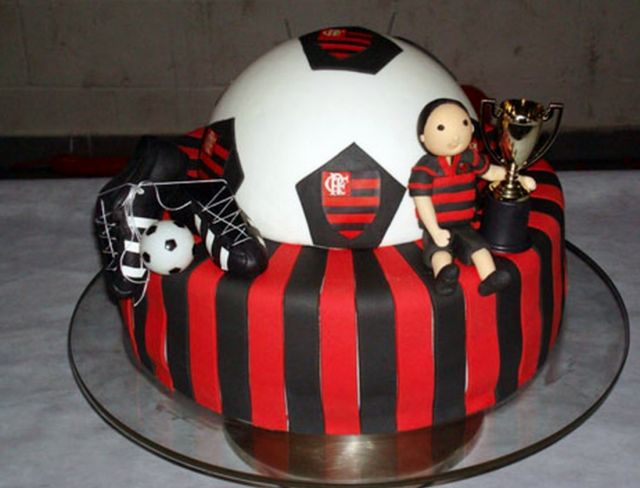 Soccer theme birthday cake with black red stripes and trophy.JPG