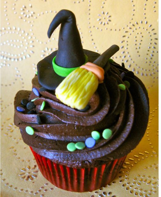 Chocolate cupcake with witch hat and broom.JPG