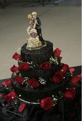Dark chocolate wedding halloween cake with full of red roses.JPG