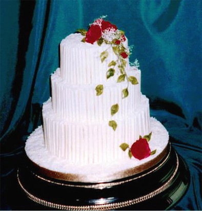 three tier white cake with flowers