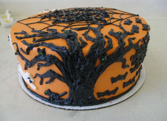 Orange halloween cake with black tree branches.JPG