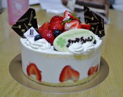 Small White Cream Birthday Cake with Fresh Strawberries & Chocolate Slabs.JPG