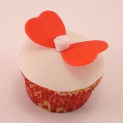 White cupcake with orange butterfly heart.JPG