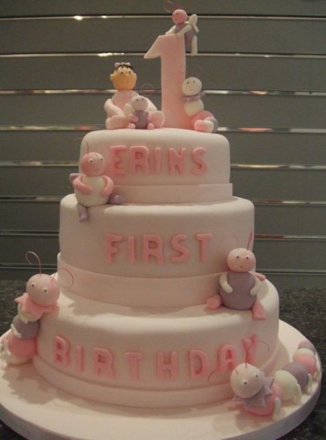 Three tier light 1st birthday cake with bugs and catepillar.JPG