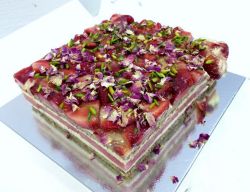 Layered Strawberry Cake with Flower Petal & Pistachio Pieces on Top.JPG
