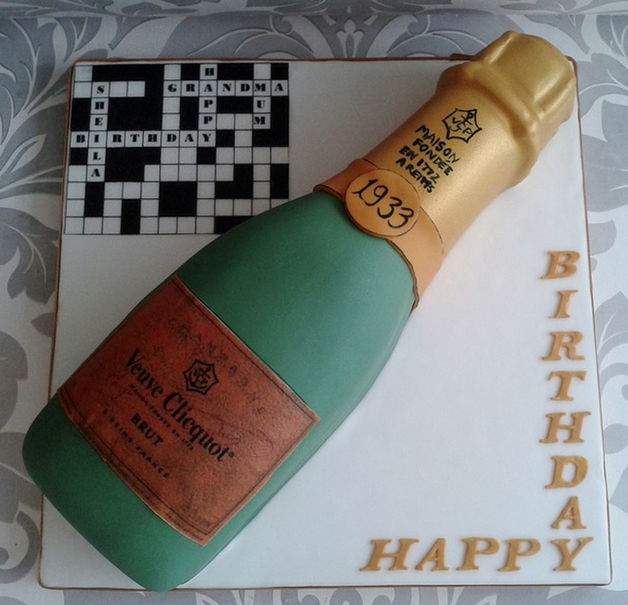 Crosswords and Champagne bottle birthday cake for Grandmother.JPG
