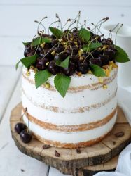 White Cream Layered Cake with Fresh Cherries on top.JPG