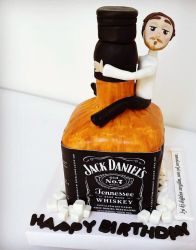 Cool Jack Daniels Whiskey Cake with Man Hugging Bottle.JPG