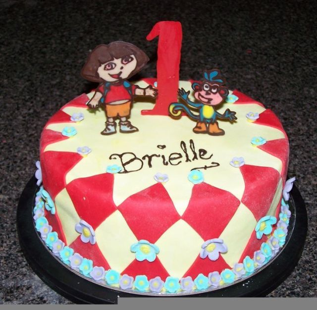 Dora and Boots first birthday cake in red and white.JPG