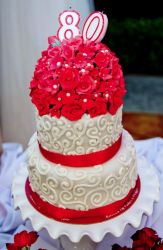 Small 2 Tier 80th Birthday Cake with Bouquet of Red Flowers on Top.JPG