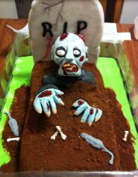 Zombie cake with zombie coming out from the grave.JPG