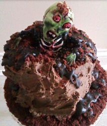 Zombie Birthday Cake with zombie coming out from the garveyard.JPG