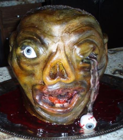 Scary looking zombie cake with eye pupping out.JPG