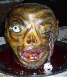 Scary looking zombie cake with eye pupping out.JPG